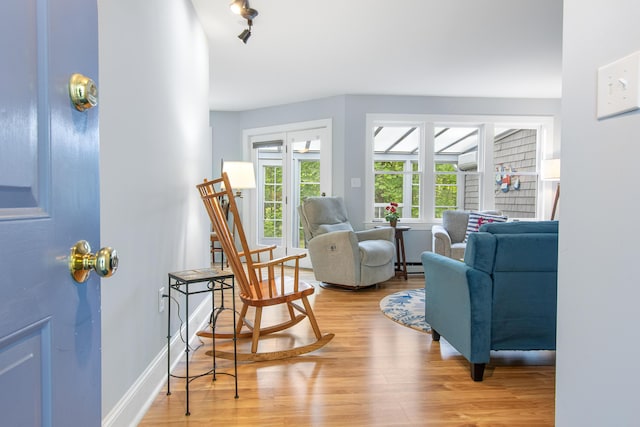 65 Pine Point Rd Unit 7, Scarborough, ME 04074 - living room featuring light wood-style flooring, baseboard heating, and a wall mounted air conditioner