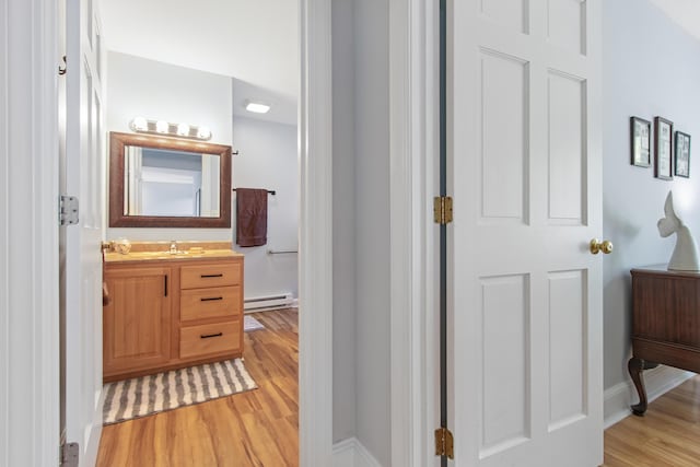 65 Pine Point Rd Unit 7, Scarborough, ME 04074 - corridor featuring a baseboard heating unit and light wood-type flooring