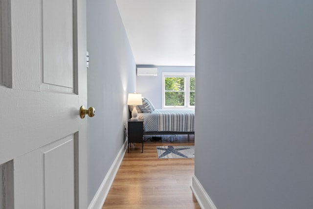 65 Pine Point Rd Unit 7, Scarborough, ME 04074 - bedroom featuring light wood-style flooring and a wall unit AC