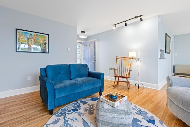 65 Pine Point Rd Unit 7, Scarborough, ME 04074 - living area with rail lighting and light wood-type flooring