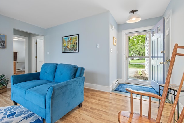 65 Pine Point Rd Unit 7, Scarborough, ME 04074 - living area with light wood finished floors and a baseboard radiator