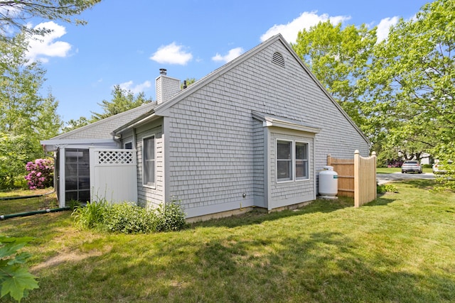 65 Pine Point Rd Unit 7, Scarborough, ME 04074 - view of side of property featuring a chimney and a yard