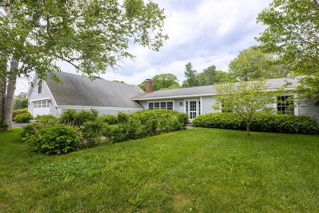 8 Broad Cove Rd, Cape Elizabeth, ME 04107 - view of front of home featuring a garage, a chimney, and a front lawn
