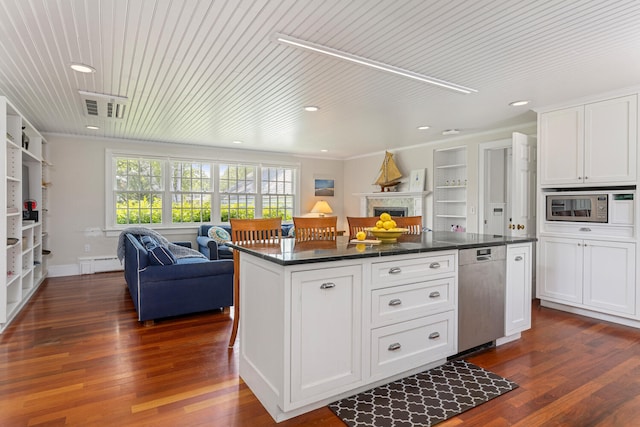 8 Broad Cove Rd, Cape Elizabeth, ME 04107 - kitchen featuring appliances with stainless steel finishes, open floor plan, dark countertops, white cabinets, and dark wood-type flooring