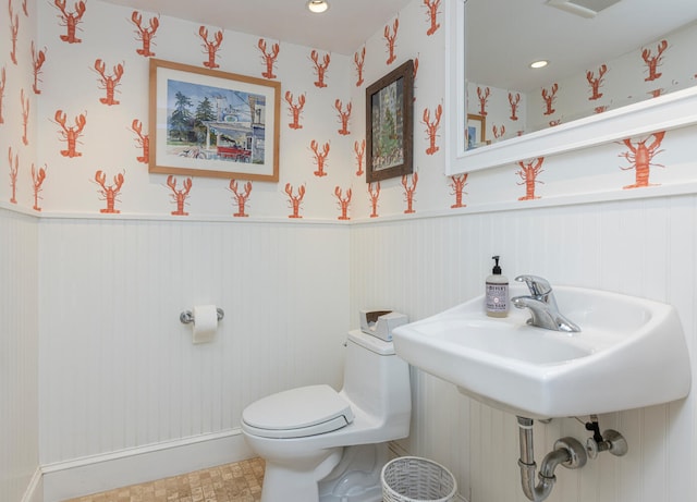 8 Broad Cove Rd, Cape Elizabeth, ME 04107 - half bathroom featuring wainscoting, recessed lighting, and wallpapered walls