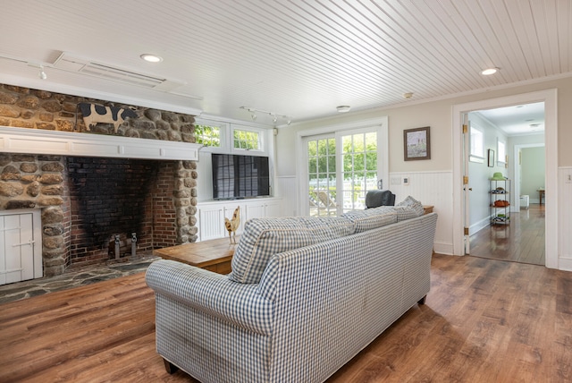 8 Broad Cove Rd, Cape Elizabeth, ME 04107 - living area with track lighting, a wainscoted wall, a fireplace, wood finished floors, and ornamental molding