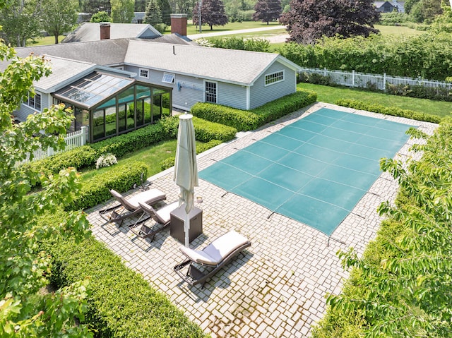 8 Broad Cove Rd, Cape Elizabeth, ME 04107 - view of swimming pool featuring a patio area, a sunroom, and view of wooded area