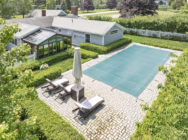 8 Broad Cove Rd, Cape Elizabeth, ME 04107 - view of swimming pool with a patio area, a sunroom, and view of scattered trees