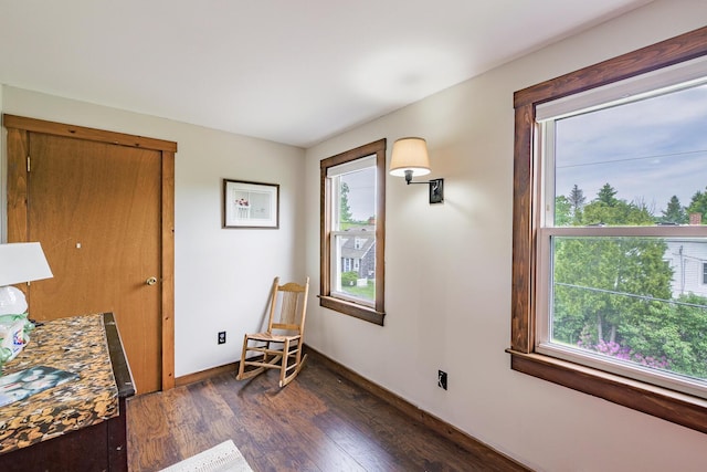 16 Lawn Ave, Rockland, ME 04841 - sitting room with dark wood-style flooring and baseboards