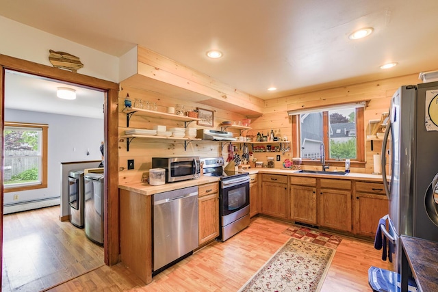 16 Lawn Ave, Rockland, ME 04841 - kitchen with stainless steel appliances, baseboard heating, open shelves, light wood-style flooring, and recessed lighting