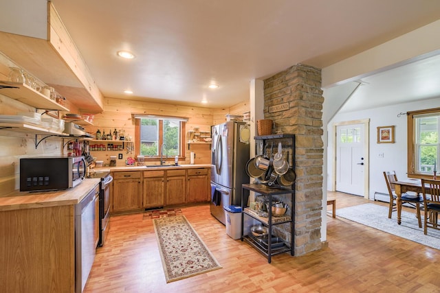 16 Lawn Ave, Rockland, ME 04841 - kitchen with open shelves, stainless steel appliances, light wood finished floors, wood counters, and brown cabinetry