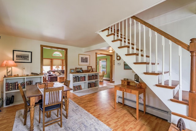 16 Lawn Ave, Rockland, ME 04841 - dining area featuring baseboard heating, plenty of natural light, and wood finished floors