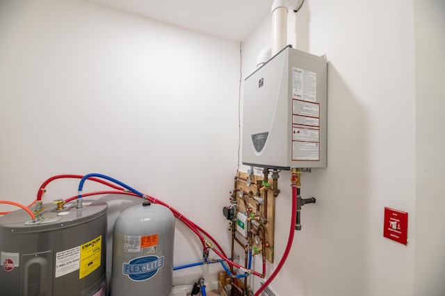 6 Walker Rd, Embden, ME 04958 - utility room with water heater and tankless water heater