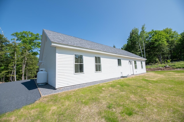 6 Walker Rd, Embden, ME 04958 - view of home's exterior featuring a lawn and roof with shingles