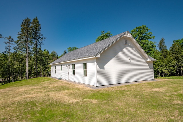 6 Walker Rd, Embden, ME 04958 - view of home's exterior featuring a lawn and roof with shingles