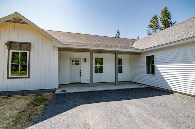 6 Walker Rd, Embden, ME 04958 - view of exterior entry with a shingled roof