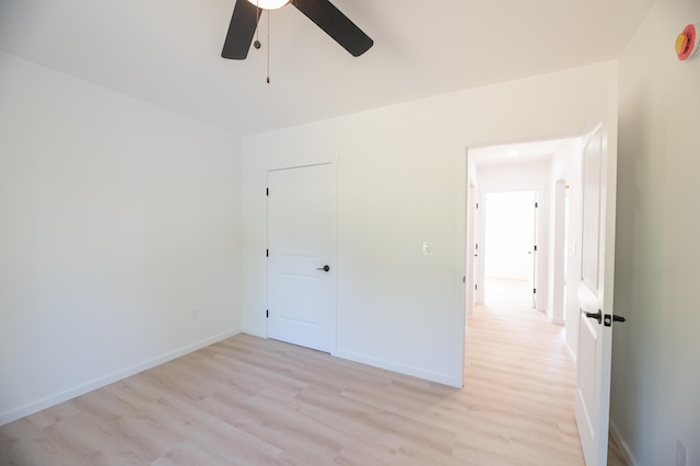 6 Walker Rd, Embden, ME 04958 - empty room featuring a ceiling fan, light wood-style floors, and baseboards