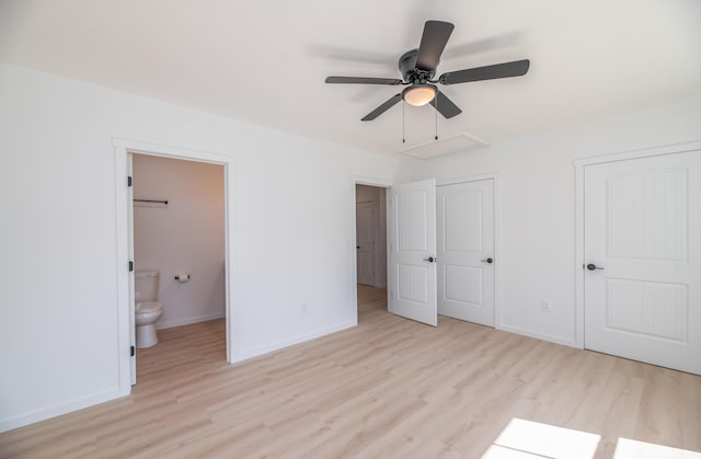 6 Walker Rd, Embden, ME 04958 - unfurnished bedroom featuring wood finished floors, baseboards, and connected bathroom