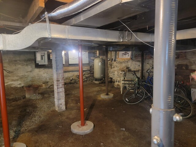 185 Elm St, Brewer, ME 04412 - unfinished below grade area featuring a water pressure tank and electric panel