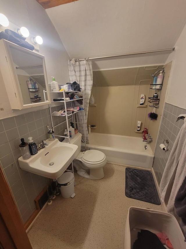 185 Elm St, Brewer, ME 04412 - bathroom featuring tile walls, shower / bath combo with shower curtain, and lofted ceiling