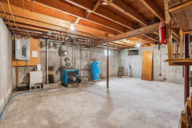 15 Bernard Ave, Biddeford, ME 04005 - unfinished basement with electric panel, a water pressure tank, and a heating unit