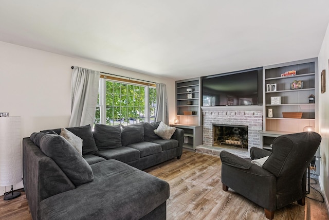 15 Bernard Ave, Biddeford, ME 04005 - living room with wood finished floors and a fireplace