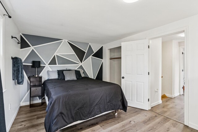 15 Bernard Ave, Biddeford, ME 04005 - bedroom featuring wood finished floors, baseboards, and a closet