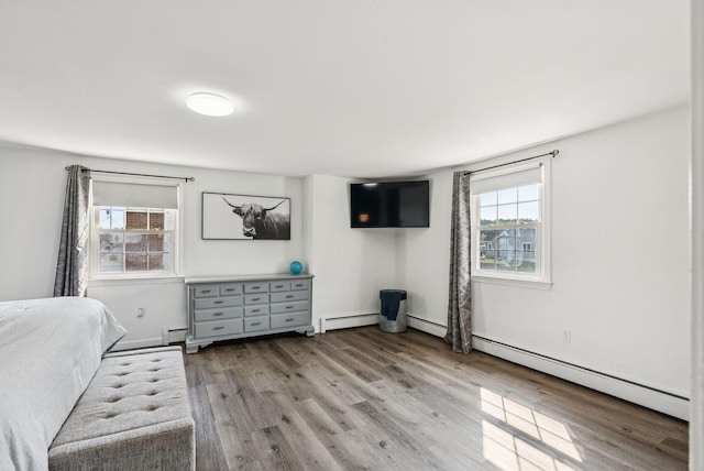 15 Bernard Ave, Biddeford, ME 04005 - unfurnished bedroom with wood finished floors, baseboard heating, and baseboards