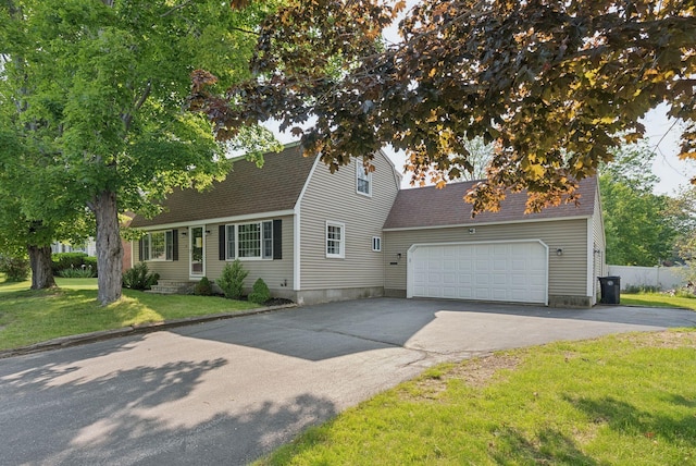 15 Bernard Ave, Biddeford, ME 04005 - view of front of property with driveway, a garage, roof with shingles, and a front yard