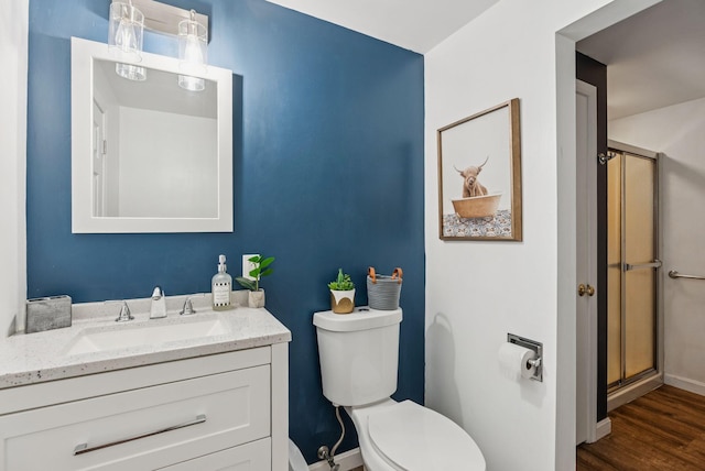 15 Bernard Ave, Biddeford, ME 04005 - bathroom with toilet, vanity, baseboards, wood finished floors, and an enclosed shower