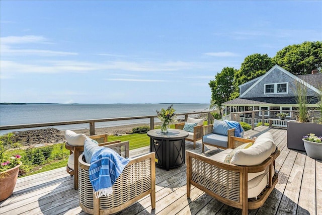 48 Ocean St, Belfast, ME 04915 - wooden deck featuring outdoor lounge area and a water view