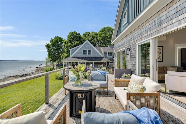 48 Ocean St, Belfast, ME 04915 - wooden terrace with an outdoor living space, view of water and beach, and a yard