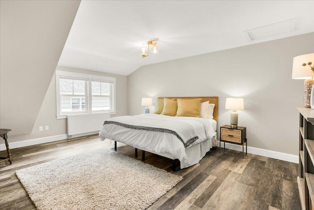 48 Ocean St, Belfast, ME 04915 - bedroom with radiator heating unit, vaulted ceiling, wood finished floors, and attic access