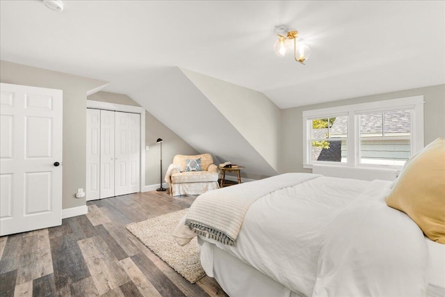 48 Ocean St, Belfast, ME 04915 - bedroom with wood finished floors, vaulted ceiling, and a closet