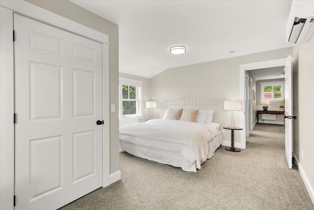 48 Ocean St, Belfast, ME 04915 - carpeted bedroom featuring a wall mounted air conditioner and lofted ceiling