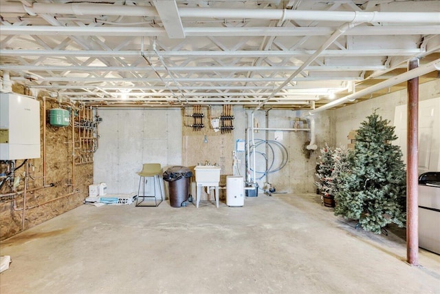 48 Ocean St, Belfast, ME 04915 - unfinished basement featuring water heater and a sink