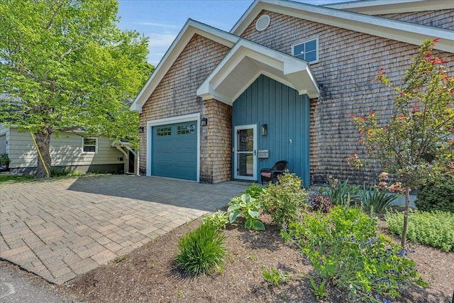 48 Ocean St, Belfast, ME 04915 - view of front of house with a garage, board and batten siding, and driveway