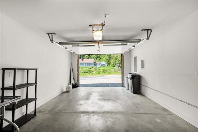 48 Ocean St, Belfast, ME 04915 - garage with electric panel and a garage door opener