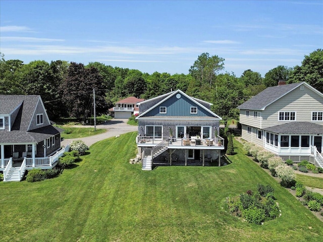 48 Ocean St, Belfast, ME 04915 - back of house with stairs, a lawn, and a deck