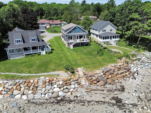 48 Ocean St, Belfast, ME 04915 - aerial view of property and surrounding area with a heavily wooded area