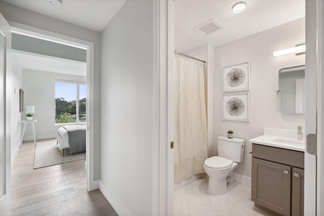 387 Commercial St Unit 527, Portland, ME 04101 - full bath featuring vanity, wood finished floors, and a shower with shower curtain