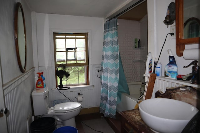 95 Wiley Rd, Greene, ME 04236 - bathroom featuring wainscoting, toilet, shower / tub combo, and vanity