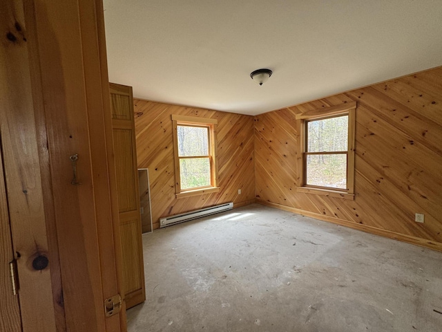 47 Witham Ln, Augusta, ME 04330 - additional living space with a baseboard radiator, plenty of natural light, and wooden walls