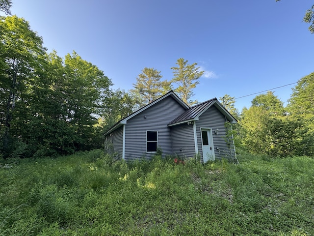 47 Witham Ln, Augusta, ME 04330 - view of property exterior with metal roof