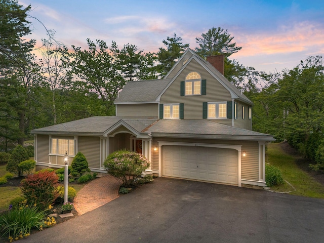 21 Glenhaven Cir W, Saco, ME 04072 - traditional-style home with asphalt driveway, a chimney, and an attached garage