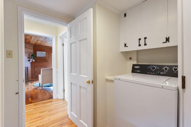 21 Glenhaven Cir W, Saco, ME 04072 - laundry area featuring washer / clothes dryer, cabinet space, light wood-style floors, and crown molding