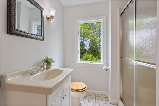 21 Glenhaven Cir W, Saco, ME 04072 - full bathroom with vanity, a shower stall, toilet, baseboards, and tile patterned floors