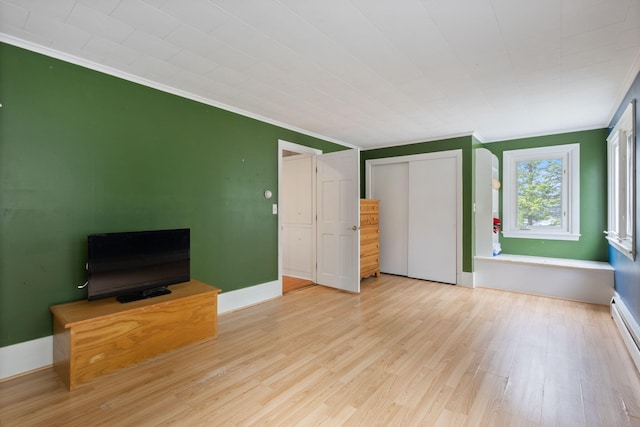 21 Glenhaven Cir W, Saco, ME 04072 - unfurnished living room with ornamental molding, wood finished floors, baseboards, and a baseboard heating unit