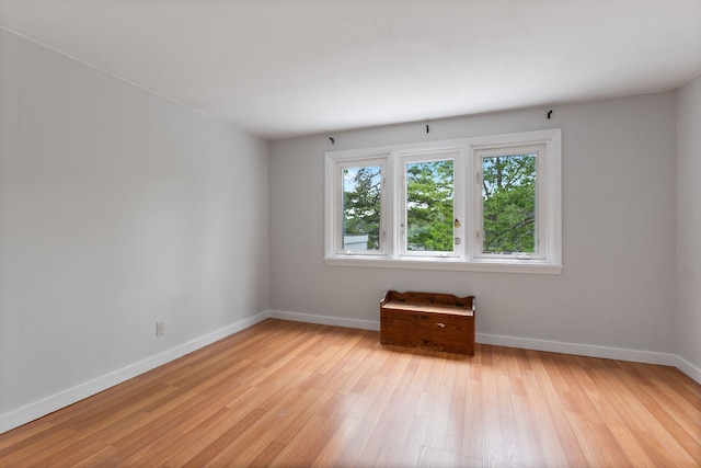 21 Glenhaven Cir W, Saco, ME 04072 - empty room with light wood-style floors and baseboards