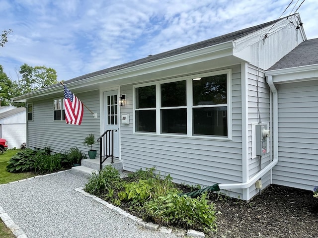 10 Crawford Dr, Bath, ME 04530 - view of front of home with entry steps, a garage, and roof with shingles